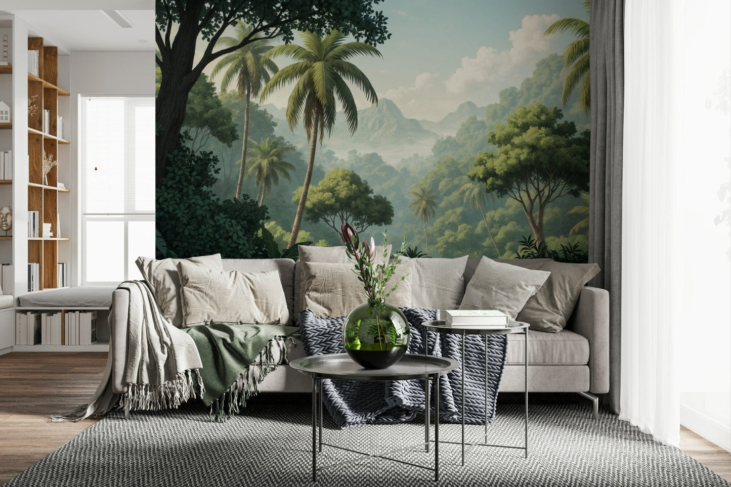 Palm Vista wallpaper mural of dense green jungle behind a gray sectional with a sage throw in a living room