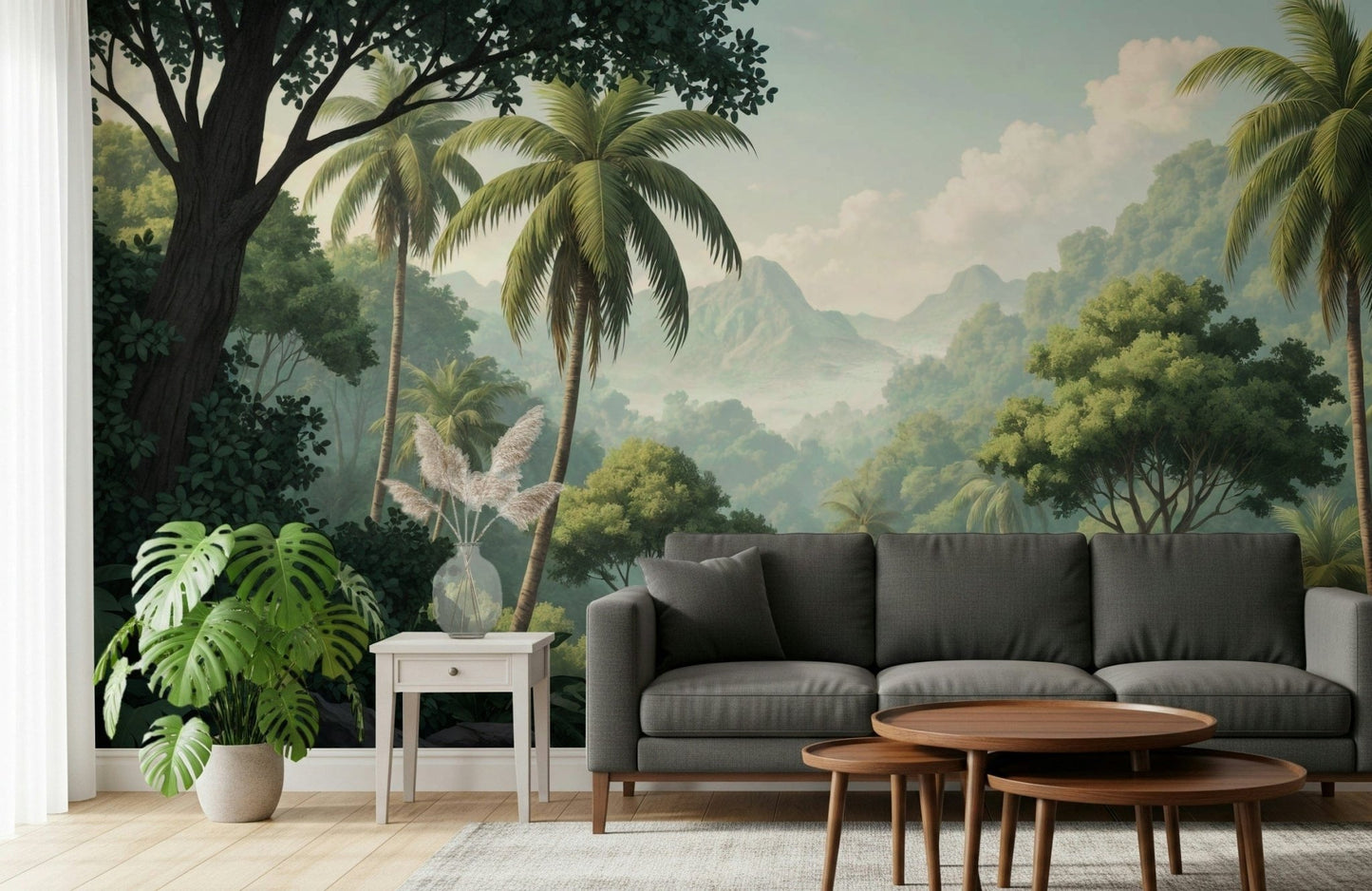 Palm Vista wallpaper mural of palms and misty peaks behind a charcoal sofa and monstera plant in a living room