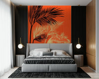 Palms at Sunset wallpaper mural with black palms on orange above a gray bed framed by dark slatted panels