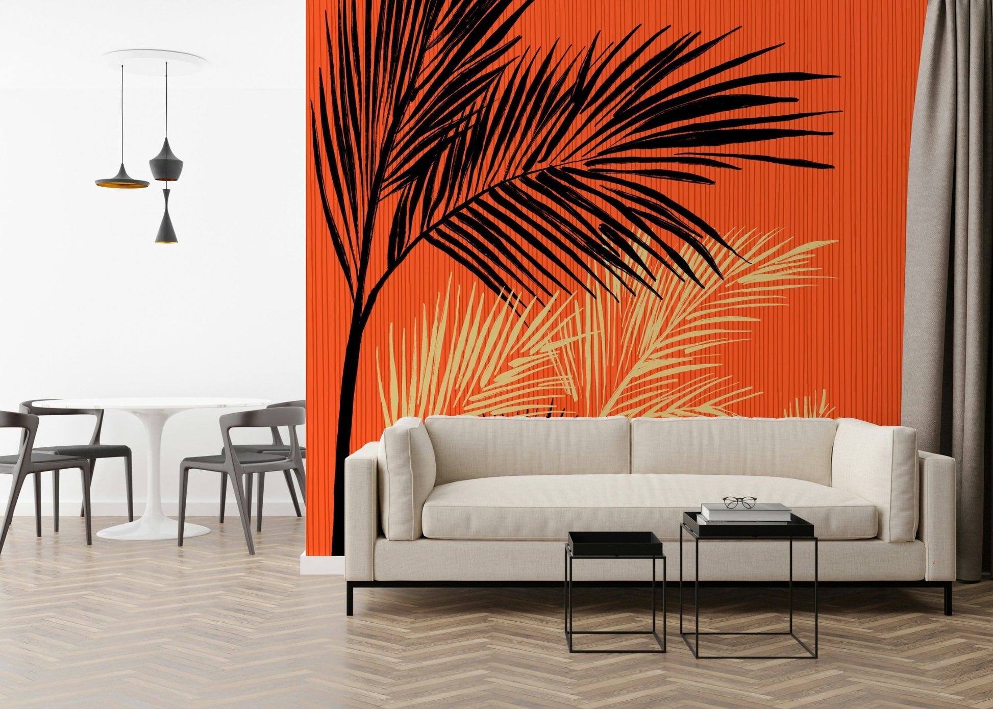 Palms at Sunset wallpaper mural with black and cream palms on orange behind a cream sofa and black side tables