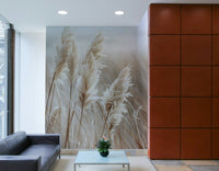 Elegant wall mural of pampas grass against the ocean

