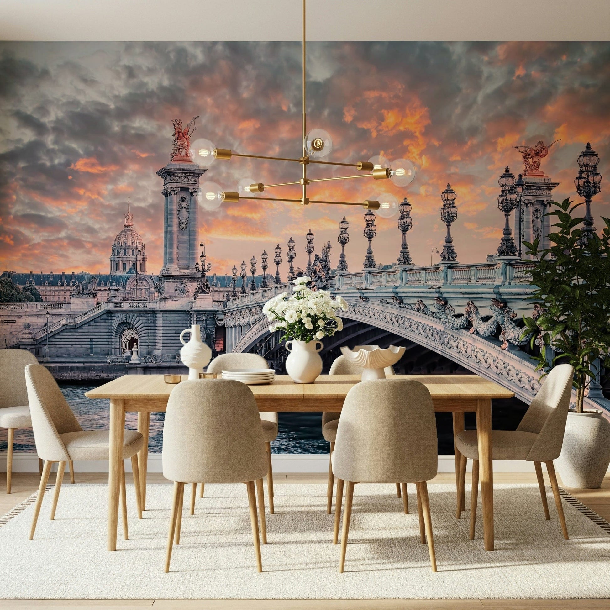 Parisian Bridge Sunset wallpaper mural with the Paris bridge behind a wood dining table and beige chairs