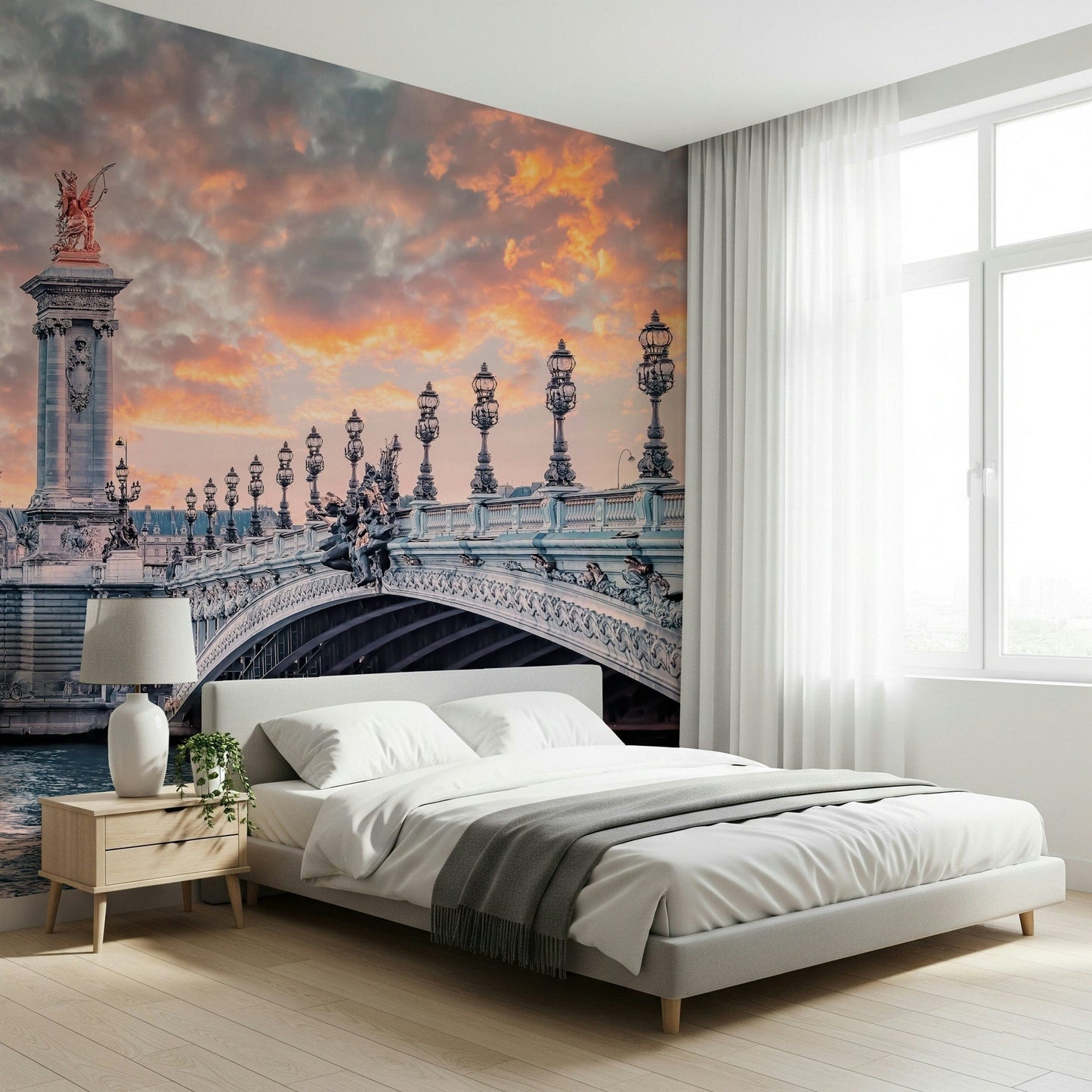 Parisian Bridge Sunset wallpaper mural showing the glowing Paris bridge behind a white platform bed in a bedroom