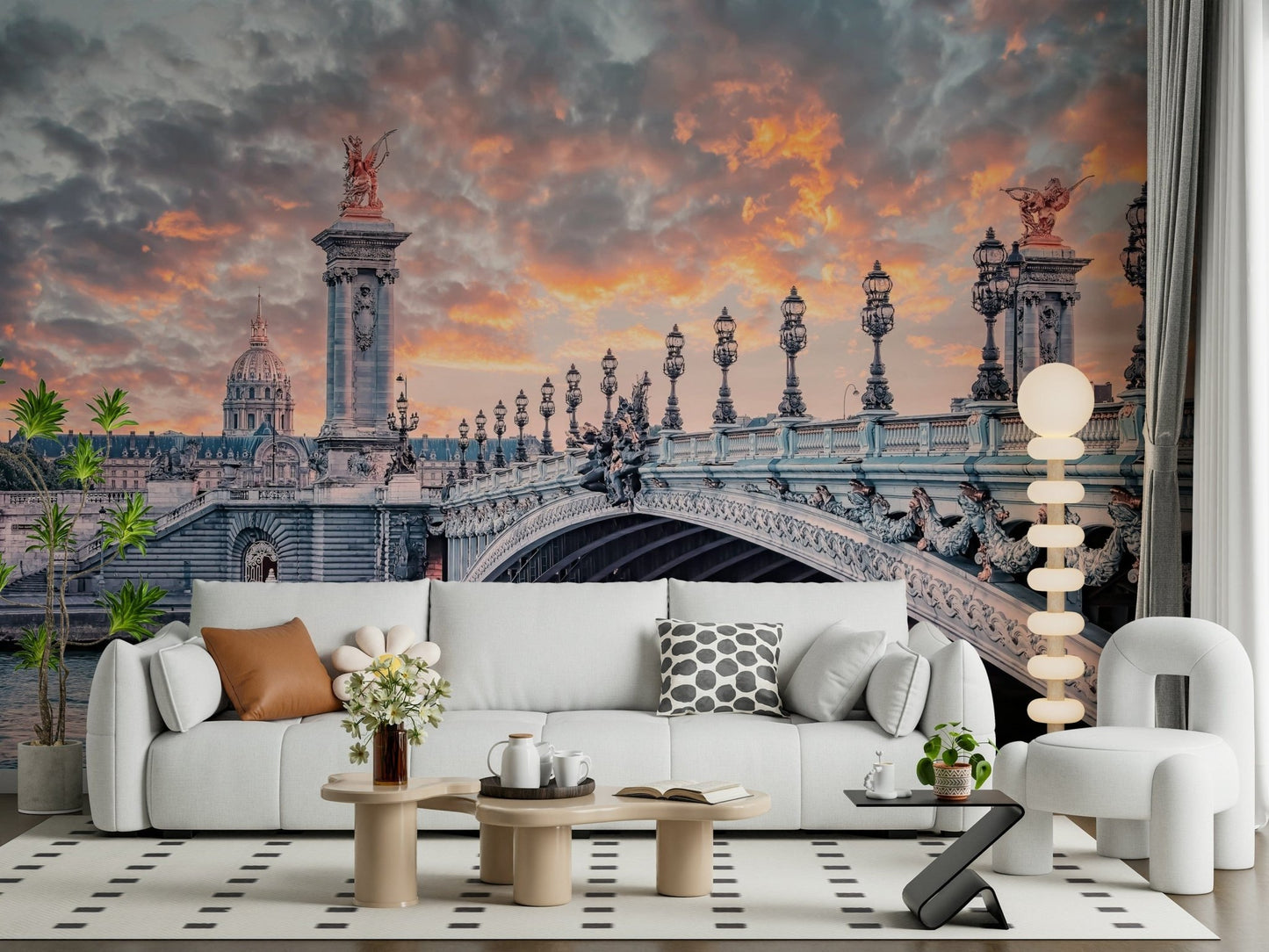 Parisian Bridge Sunset wallpaper mural with the Pont Alexandre III behind a white boucle sofa and curved armchair