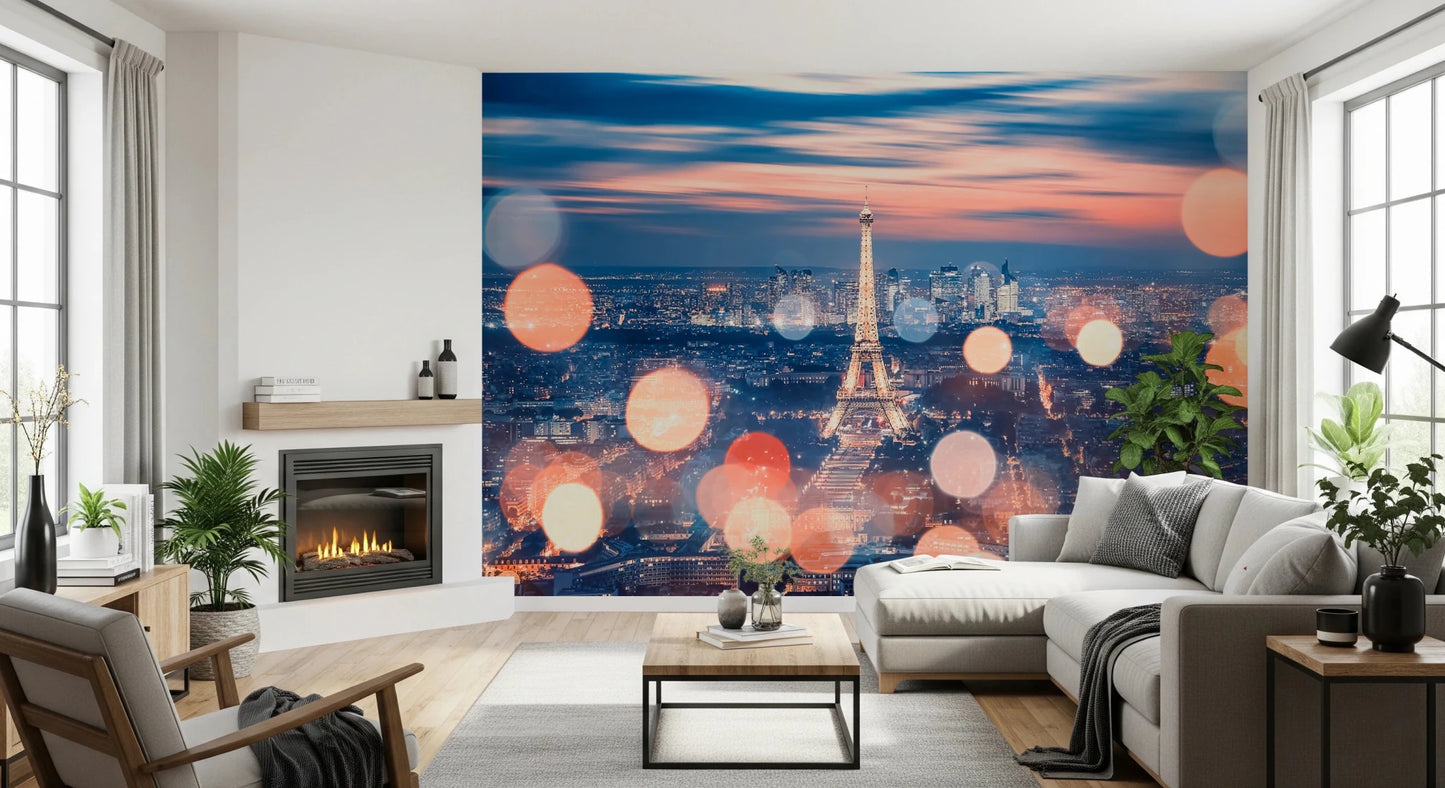 Parisian Lights wallpaper mural of the lit Eiffel Tower beside a fireplace and grey sectional in a living room