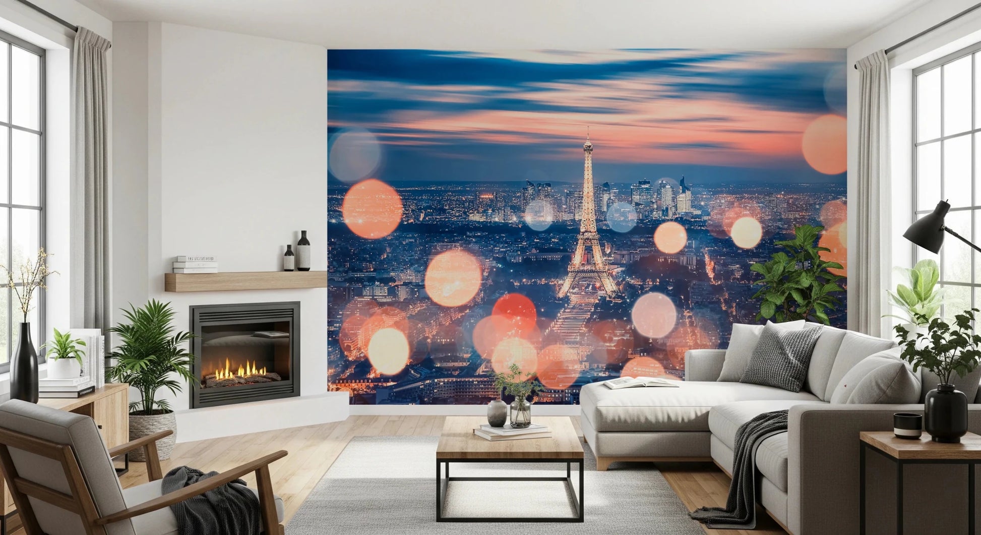 Parisian Lights wallpaper mural of the lit Eiffel Tower beside a fireplace and grey sectional in a living room