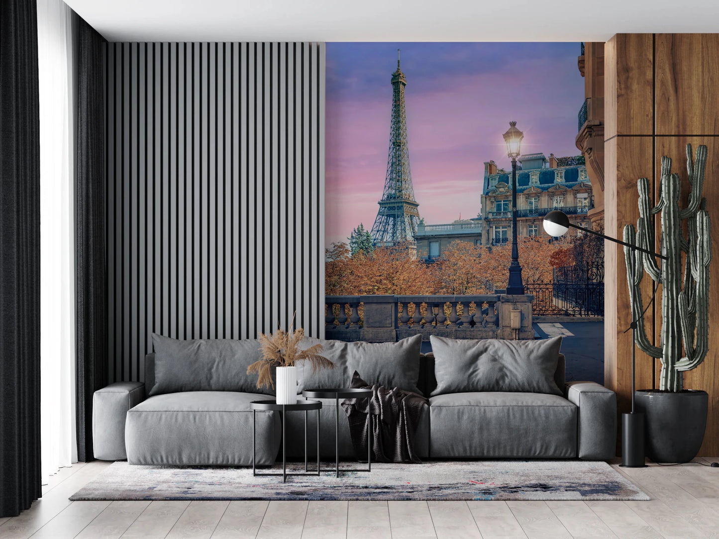 Parisian Twilight wallpaper mural of the Eiffel Tower at dusk above a grey sofa on a slatted accent wall
