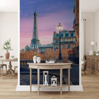 Parisian Twilight wallpaper mural with Eiffel Tower and street lamp at sunset above a wood console table in an entryway