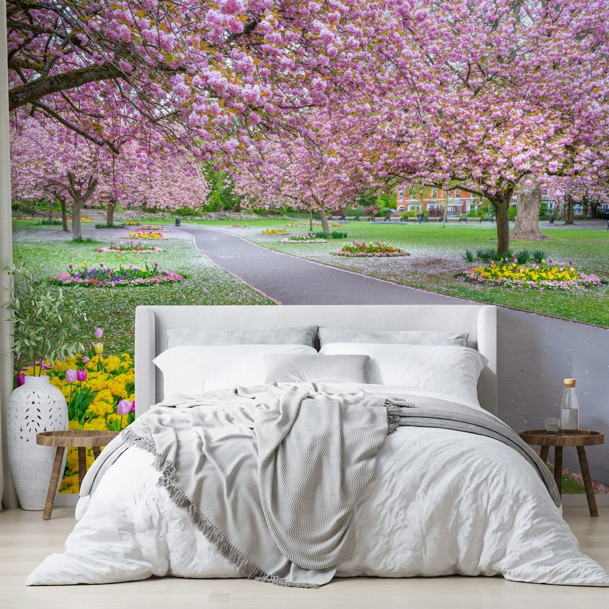 Park path mural with soft pink blossoms

