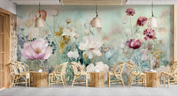 Colorful Pastel Flower wallpaper mural of watercolor blooms above rows of rattan chairs and tables in a bright cafe
