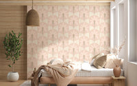 Bedroom area with pastel palm wallpaper and cream stripe detailing in warm tones