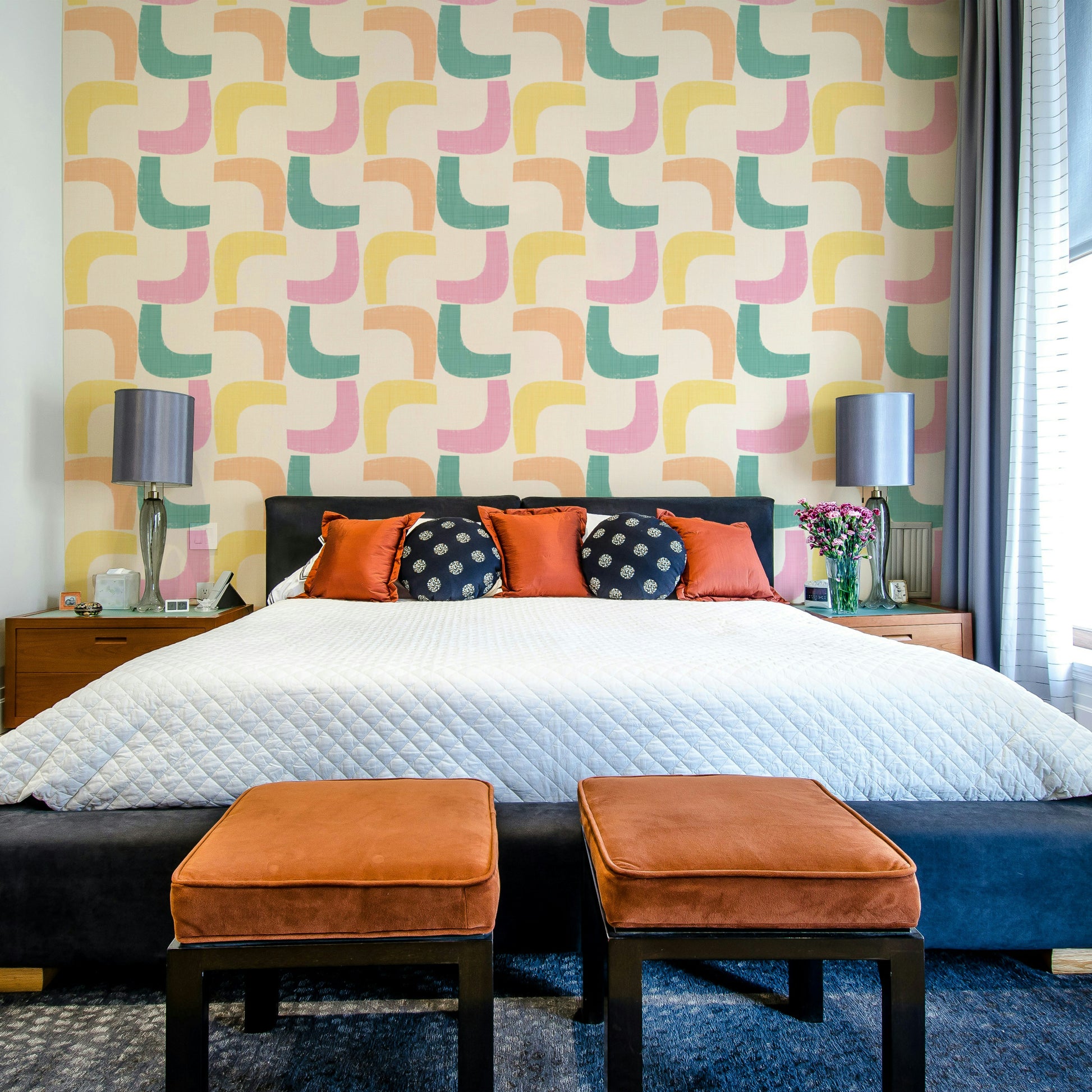 Wallpaper featuring retro boomerang pattern in soft pastel hues.

