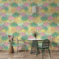 Palm Springs-inspired wallpaper featuring aqua green tropical leaves.

