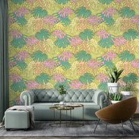 Retro avocado wallpaper with tropical palm leaves in soft pastel colors.

