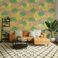Soft pastel tropical wallpaper featuring Monstera leaves in avocado green.

