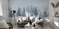 Winter Wonderland Forest wallpaper mural of snowy blue trees behind a grey sofa with a black tripod lamp