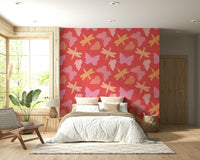 Patterned butterfly wallpaper featuring pastel wings arranged across a coral-red backdrop.