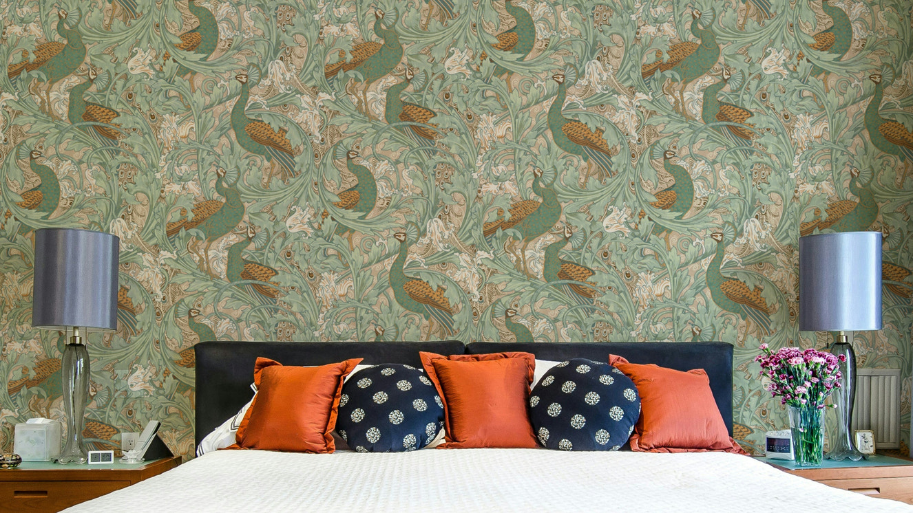 Ornate peacock wallpaper in green and mustard for a modern home styling project.