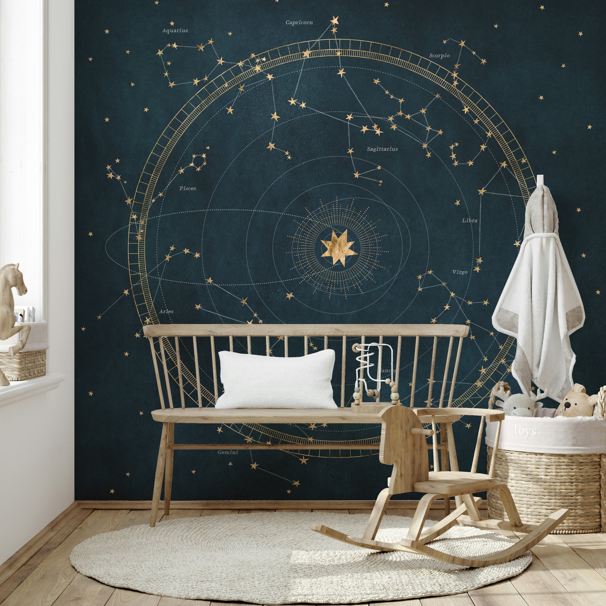 Astro wheel with cosmic motifs on petrol blue background.


