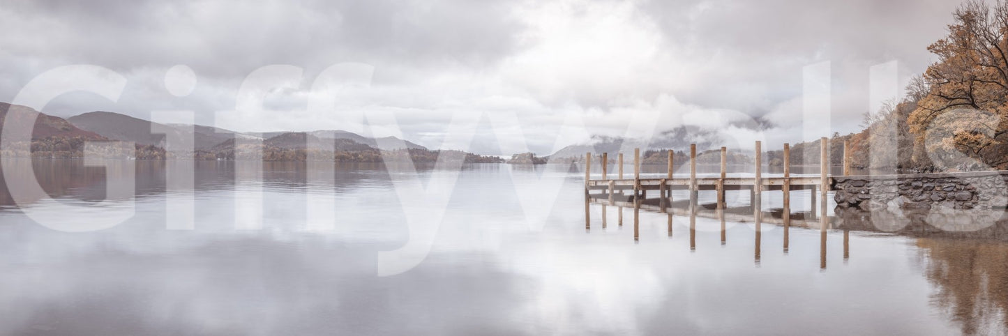 Lakeside pier mural with soft colors and scenic mountain backdrop.

