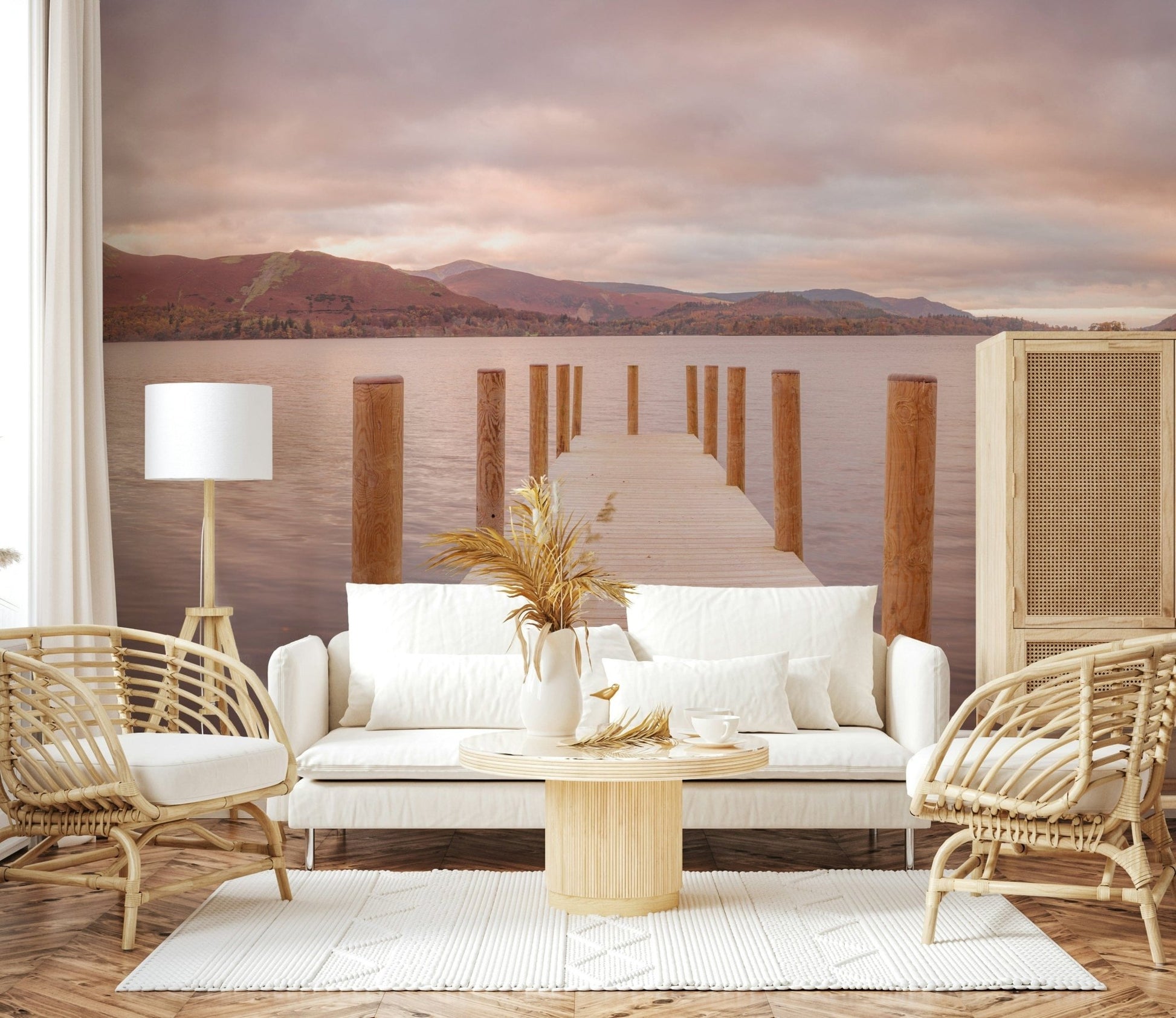 Piering into Nature's Heart wallpaper mural of a calm lake jetty behind a white sofa and two rattan chairs