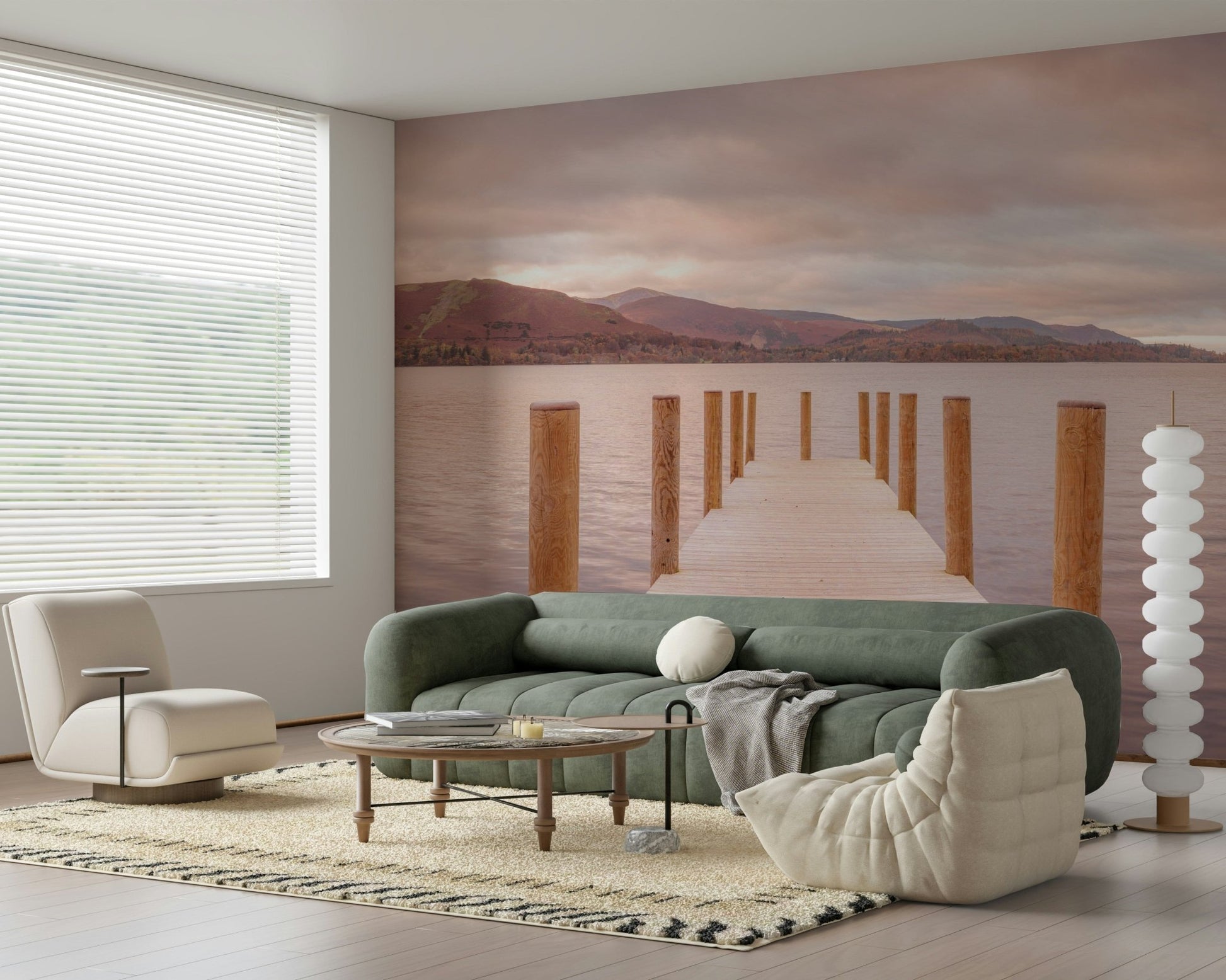 Piering into Nature's Heart wallpaper mural of a sunset lake jetty behind a green tufted sofa and cream Togo chair