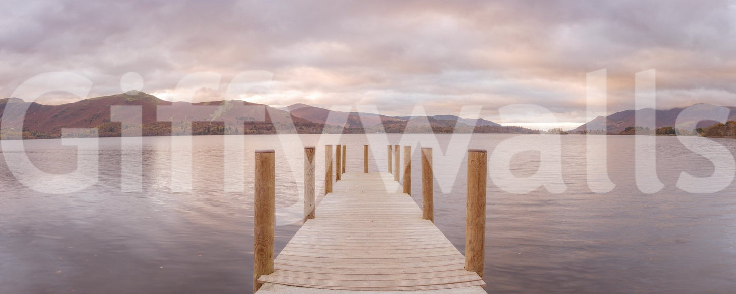 Piering into Nature's Heart wallpaper mural shown as a full-wall view of a wooden jetty on a calm mountain lake at sunset