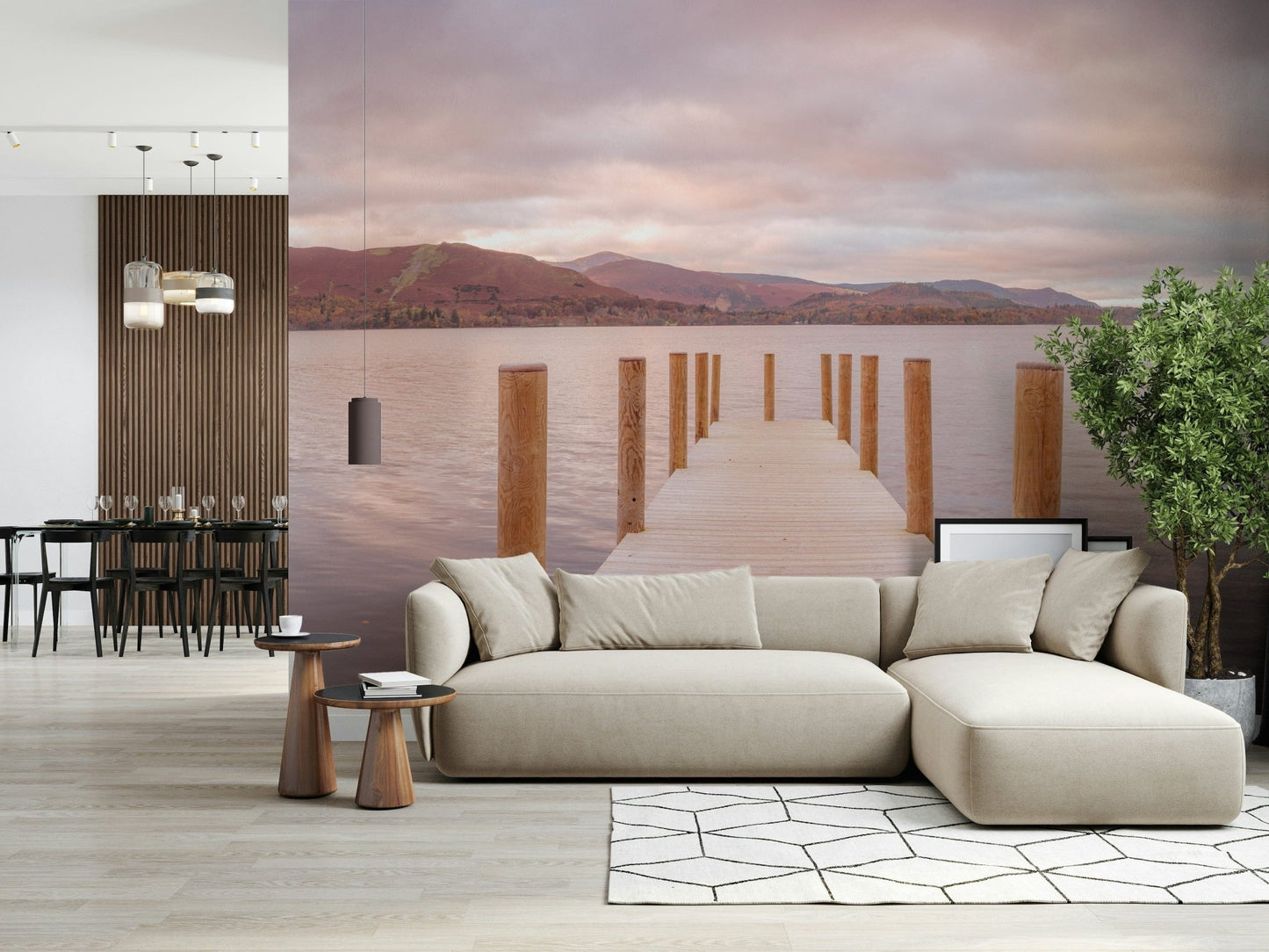 Piering into Nature's Heart wallpaper mural of a lake pier behind a beige L-shaped sectional in an open-plan living room