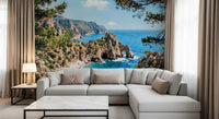 Cliffside coast wall mural with a bright cove, rocky shoreline, and blue horizon