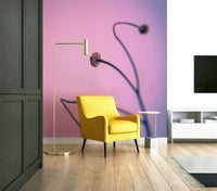 A close-up of a delicate plant stalk against a soft pink background.

