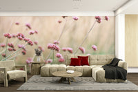 Wall mural with a soft pink flower field.

