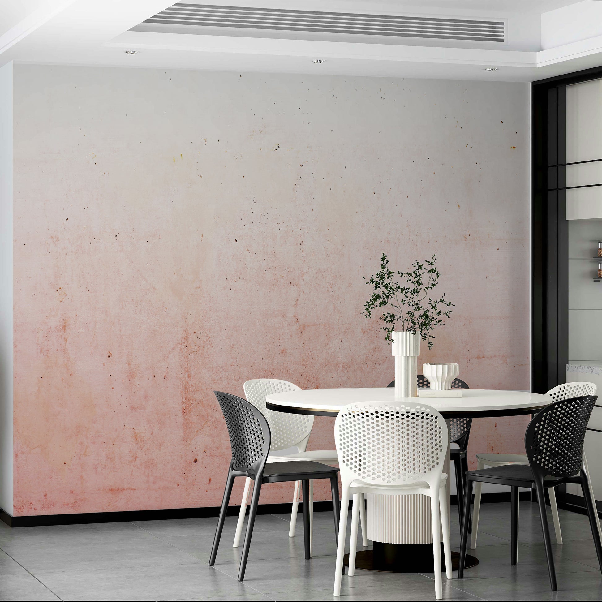 Wall mural with a pink ombre on a concrete texture.

