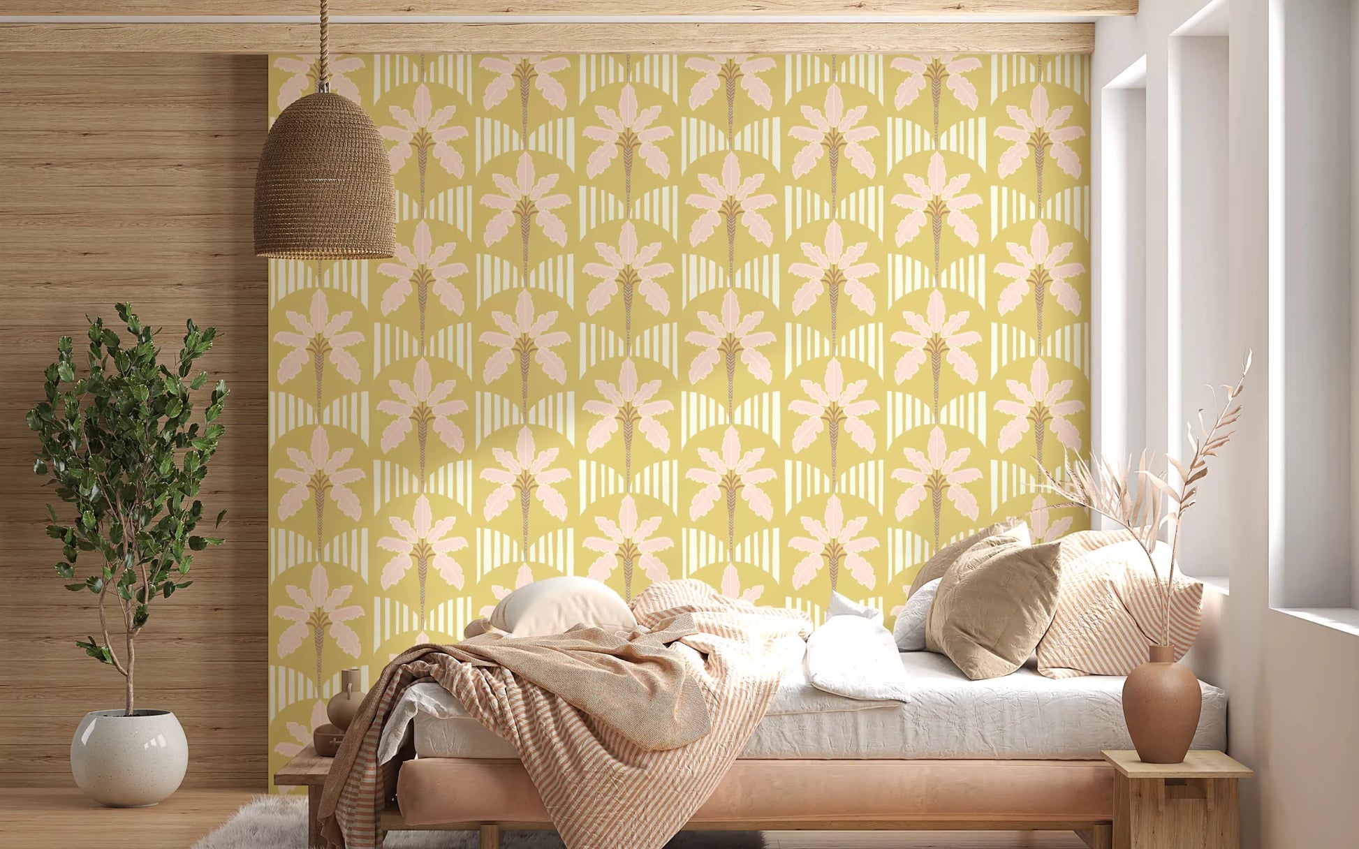 Bedroom with soft pink palm wallpaper and mustard stripe pattern in neutral tones