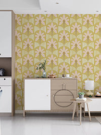 Lounge area with pink palm wallpaper and soft cream stripe detailing in mustard