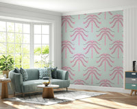A wall mural of a tropical palm leaf pattern.

