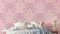 A wall mural of a tropical palm leaf pattern.

