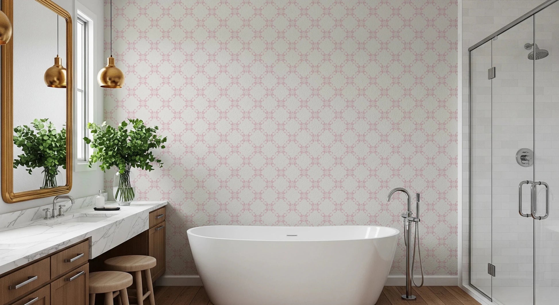 Pink Petal Lattice wallpaper behind a freestanding tub and marble vanity with gold pendants in a bathroom