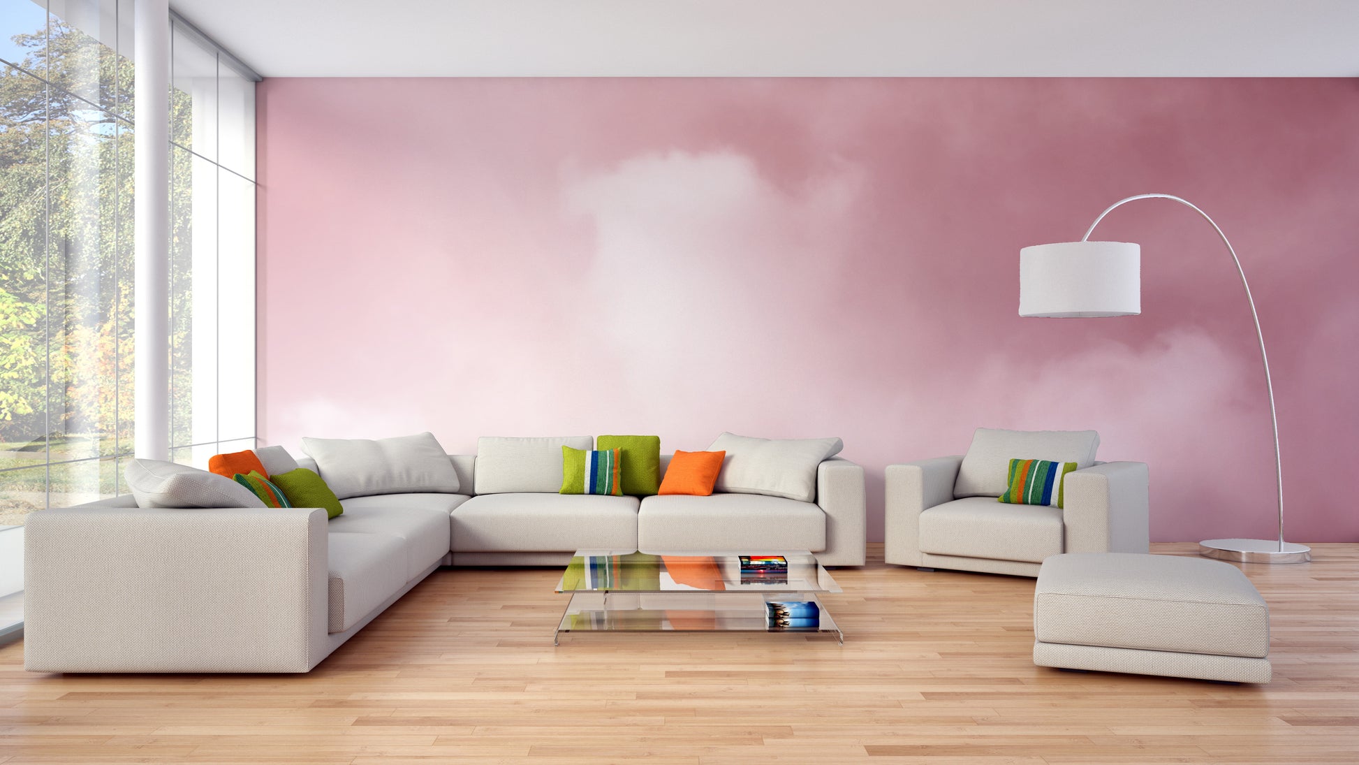 Pink Sky And Clouds wallpaper in dreamy pink behind a cream sectional sofa and arc lamp in a living room