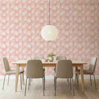 Tropical Blush wall covering pink background white leaves design.