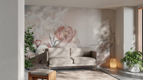 Pink White Flower wallpaper mural with soft peonies and clouds behind a cream sofa in a bright living room
