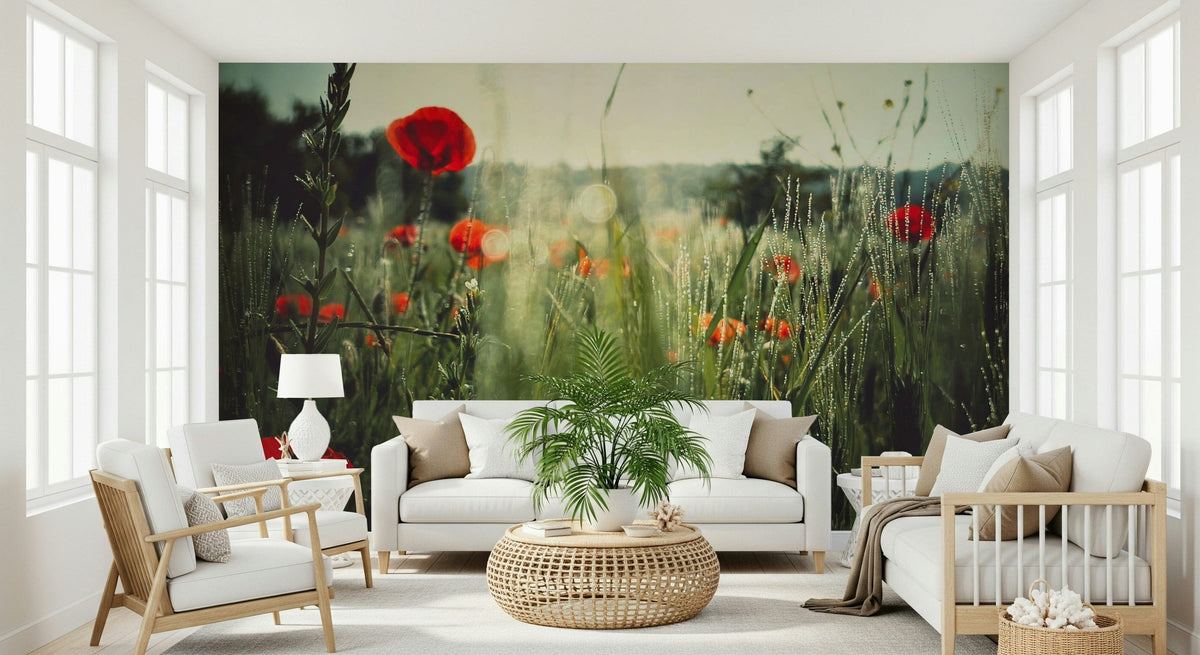 Meadow Dew mural of red poppies in dewy grass behind a white sofa and rattan table in a bright living room