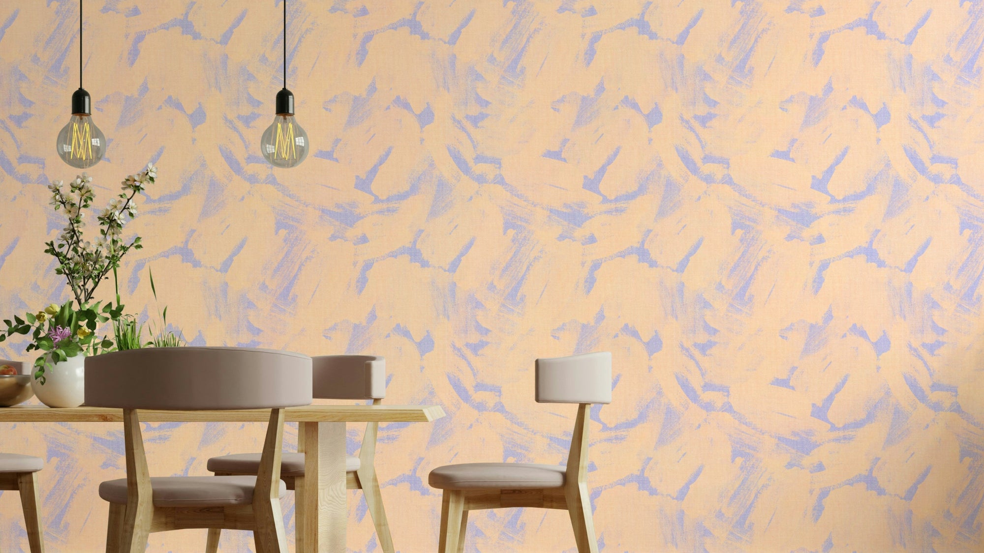Powder Pink Abstract Brushstroke wallpaper in peach and lavender in a dining room with a wooden table and bulb lamps