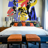 Vibrant geometric fragments creating a prismatic design mural

