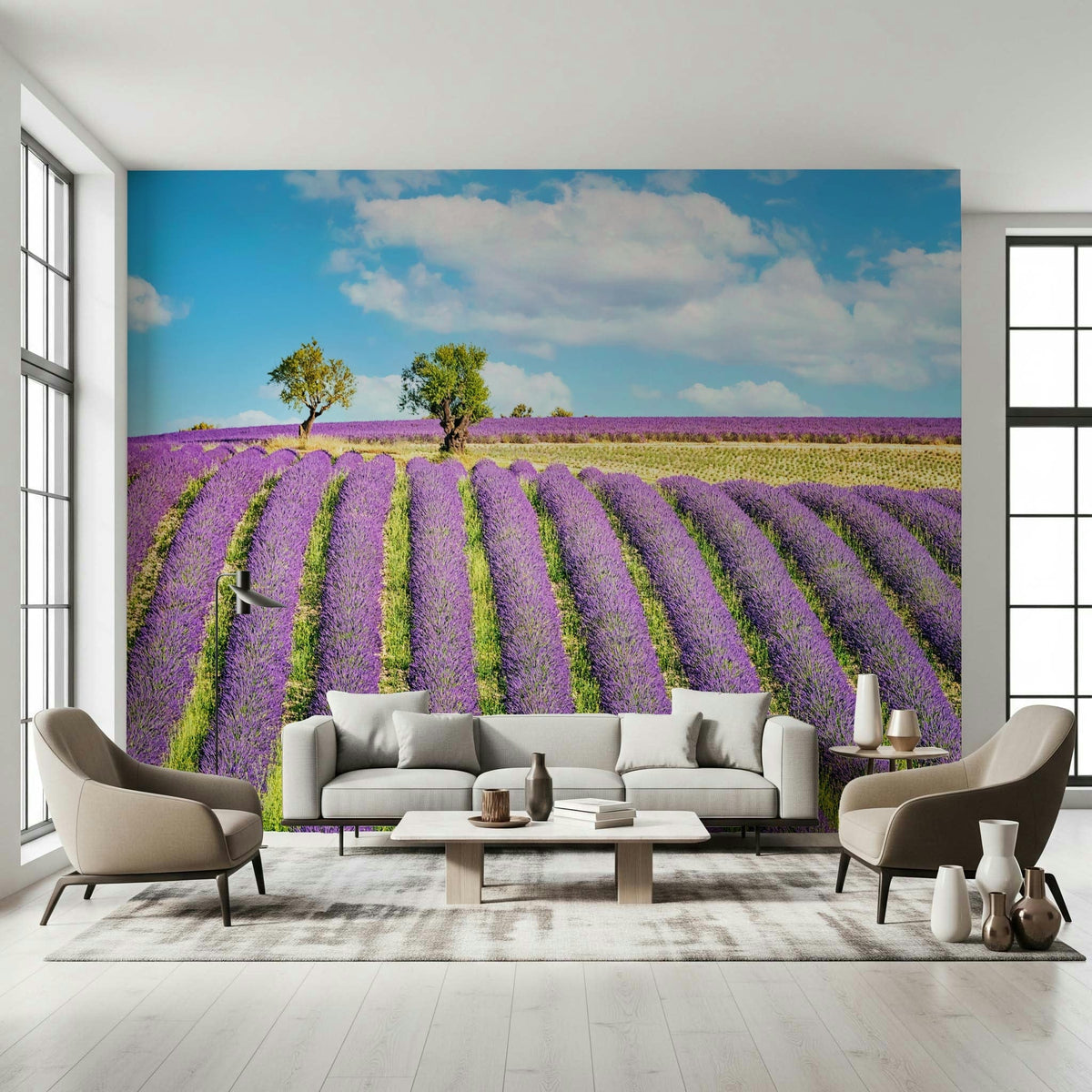 Provence Dreams wallpaper mural of purple lavender rows and trees behind a grey sofa and beige armchairs