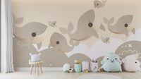 Self adhesive whale mural in a child's room with a small white stool, offering an easy and charming decor upgrade.