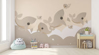 Removable Cuddly Cetaceans Wall Mural in a minimalist nursery with a white storage unit for a damage-free update.