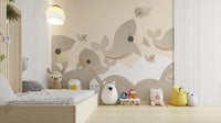 Premium Cuddly Cetaceans Wall Mural in a toddler's room with a low floor bed, creating a soft and peaceful environment.