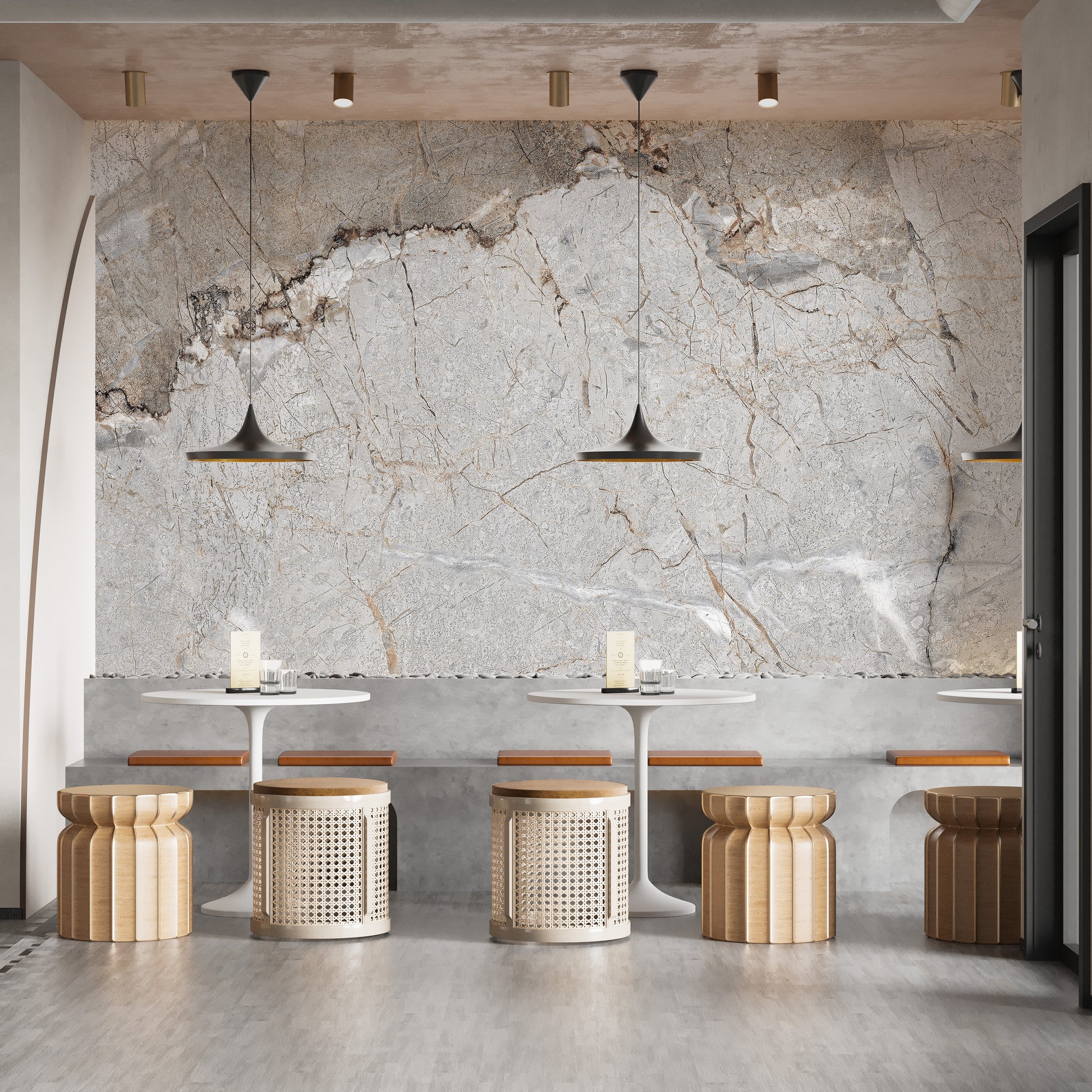 Elegant Gray Marble wallpaper mural with gold veining in a cafe with white bistro tables and woven rattan stools