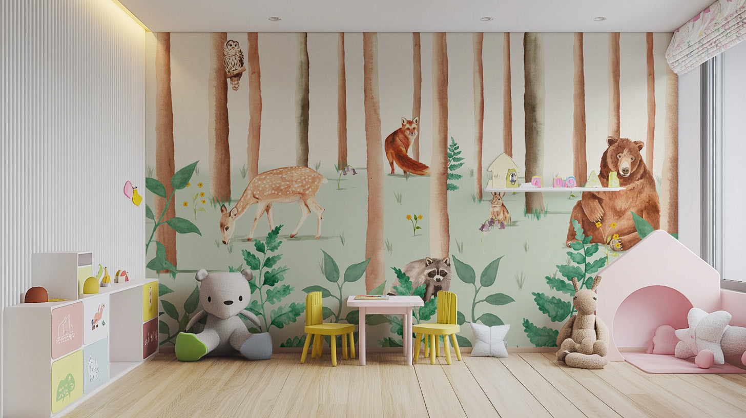 Storybook Wildlife wallpaper mural of woodland animals in a playroom with yellow table, teddy bear and pink tent