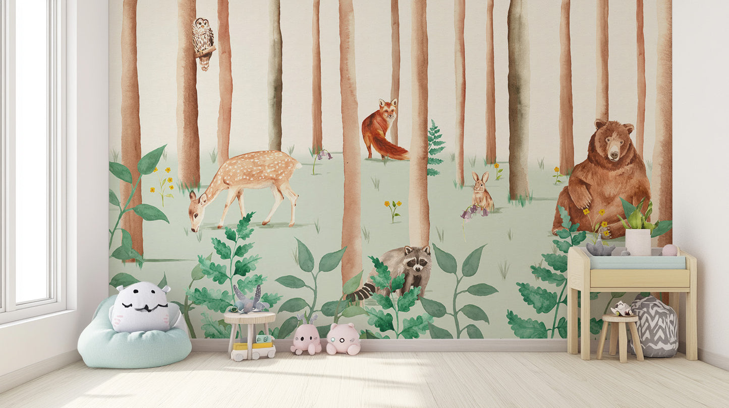 Storybook Wildlife wallpaper mural with deer, raccoon and bear in a kids room with mint beanbag and toys